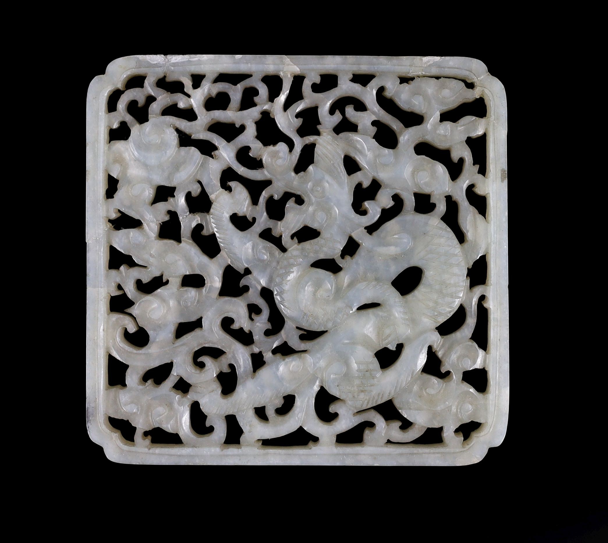 A Chinese pale celadon jade ‘Dragon’ plaque, 17th/18th century 7.5 x 7.3 cm, repaired